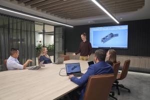 Office workers sitting at a table in a meeting